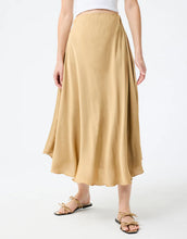 Load image into Gallery viewer, Model wearing Leo & Ugo Malia Satin Skirt in Beige.