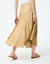 Load image into Gallery viewer, Model wearing Leo & Ugo Malia Satin Skirt in Beige - back.