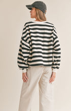 Load image into Gallery viewer, Model wearing Sadie &amp; Sage - Growth Striped Pullover in Black/Ivory - back.
