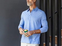Load image into Gallery viewer, Model wearing Criquet - Brrr Long Sleeve Range Polo in Lapis Blue.