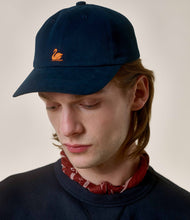 Load image into Gallery viewer, Model wearing Merz B. Schwanen - Good Basics Swan Logo Cap in Night Blue.