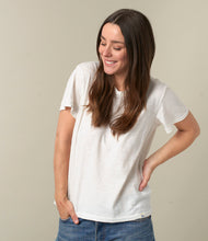 Load image into Gallery viewer, Model wearing Merz B. Schwanen - Good Basics Unisex T-shirt in White.
