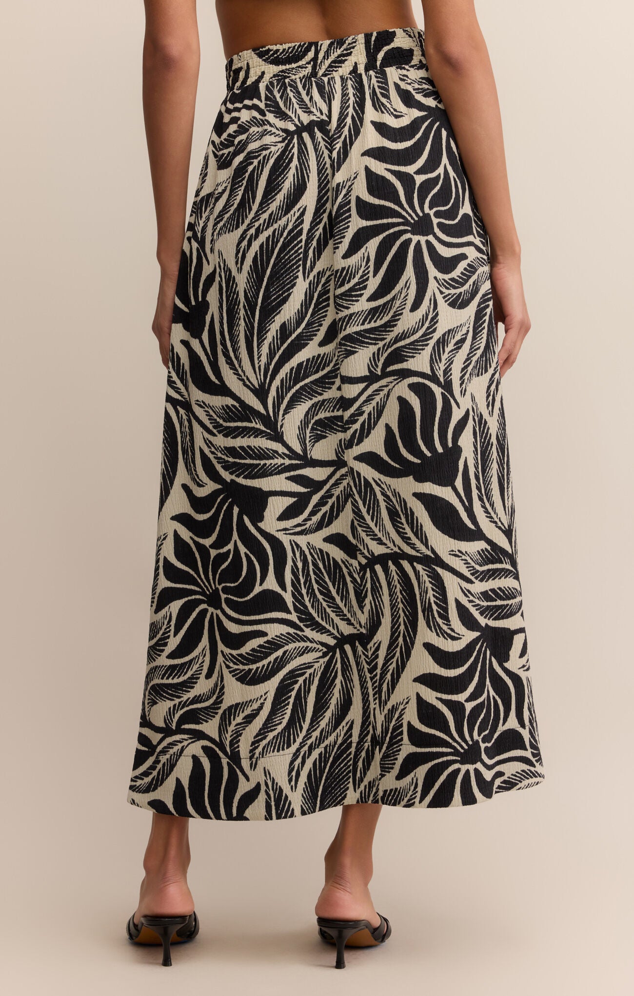 Model wearing ZSupply Serendipity Isla Leaf Skirt in Black - back.