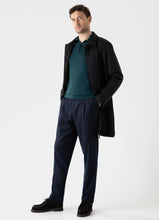 Load image into Gallery viewer, Model wearing Sunspel - Fine Merino Wool LS Polo Shirt in Peacock.
