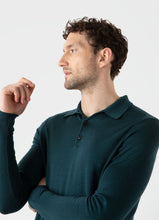 Load image into Gallery viewer, Model wearing Sunspel - Fine Merino Wool LS Polo Shirt in Peacock.