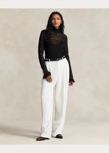 Model wearing Polo Ralph Lauren - Ruffle-Trim Pointelle-Knit Top in Black.