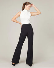 Load image into Gallery viewer, Model wearing Spanx - The Perfect Pant, Hi-Rise Flare in Classic Black 20252R.
