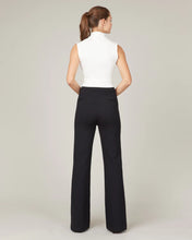 Load image into Gallery viewer, Model wearing Spanx - The Perfect Pant, Hi-Rise Flare in Classic Black 20252R - back.

