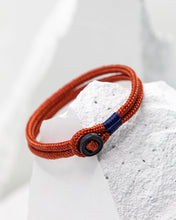 Load image into Gallery viewer, Pig & Hen Don Dino bracelet in coral red with black ring.