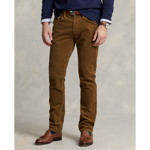 Load image into Gallery viewer, Model wearing Polo Ralph Lauren - Varick Slim Straight Stretch Corduroy 5-Pocket Pant in Sepia.
