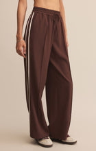 Load image into Gallery viewer, Model wearing ZSupply Saunder Track Pant in Sandalwood.

