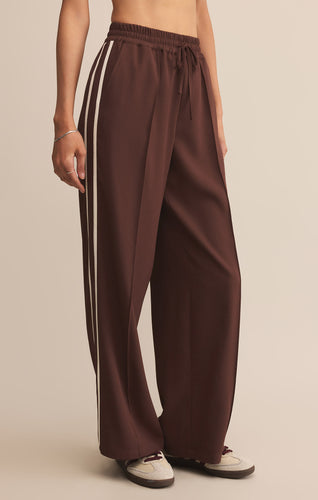 Model wearing ZSupply Saunder Track Pant in Sandalwood.