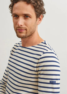 Model wearing Saint James - Minquiers Modern Men's Striped Sailor Shirt in Ecru/Marine.