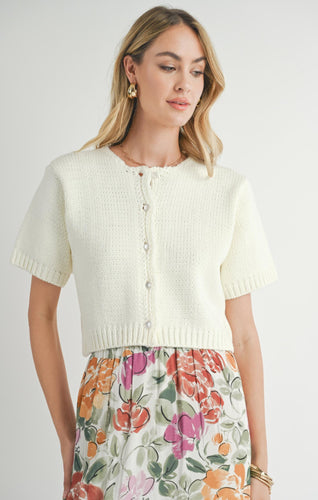 Model wearing Sadie & Sage Coco Buttoned S/S Sweater in Ivory