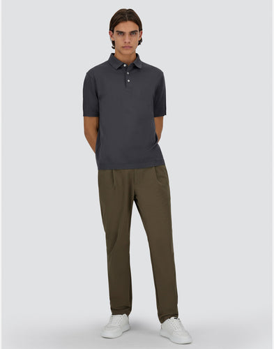 Model wearing Herno Men's Jersey Knit Effect Polo Shirt in Grigio Metallo.