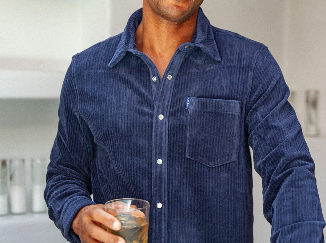 Model wearing Criquet - Velour Rib Knit Pearl Snap Button Down in Navy.