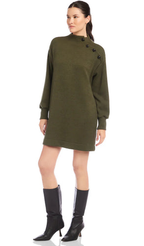 Woman wearing a green dress with buttons on a white background