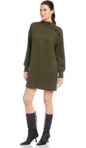 Woman wearing a green dress with buttons on a white background