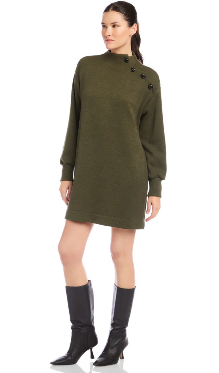 Woman wearing a green dress with buttons on a white background