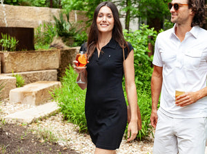 Model wearing Criquet - Women's Ladybird Polo Dress in Onyx.