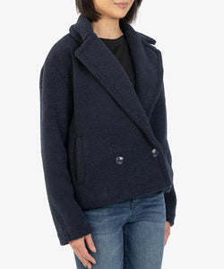 Model wearing Kut from the Kloth - Emaline Double Breasted Sherpa Coat in Navy.