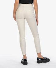 Load image into Gallery viewer, Model wearing KUT From The Kloth Charlize Coated High Rise Cigarette Leg Raw Hem Jean KP1738MA4 in Champagne.
