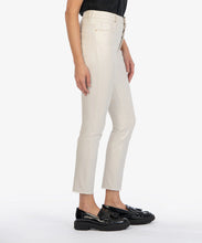 Load image into Gallery viewer, Model wearing KUT From The Kloth Charlize Coated High Rise Cigarette Leg Raw Hem Jean KP1738MA4 in Champagne.

