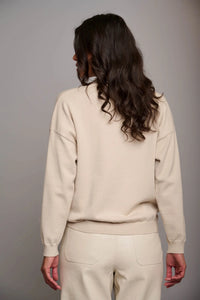 Model wearing Rino & Pelle - Kassi Sweater in Blanc - back.