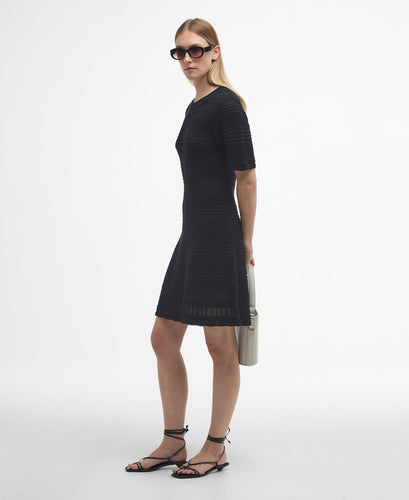 Model wearing Barbour Mia Knitted Mini Dress in Black.