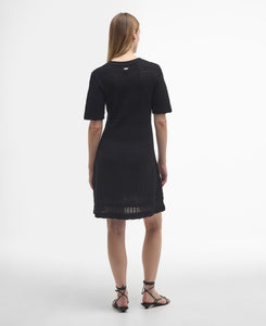 Model wearing Barbour Mia Knitted Mini Dress in Black - back.
