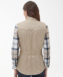 Model wearing Barbour Cavalry Gilet in Light Fawn - back.