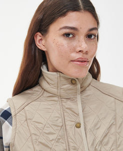 Model wearing Barbour Cavalry Gilet in Light Fawn.