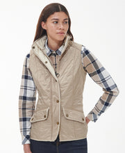 Load image into Gallery viewer, Model wearing Barbour Cavalry Gilet in Light Fawn.

