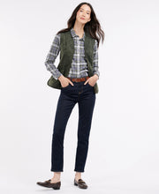 Load image into Gallery viewer, Model wearing Barbour Fleece Betty Liner in Dark Olive.
