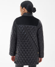 Load image into Gallery viewer, Model wearing Barbour Premium Carlton Quilt in Black/Classic - back.
