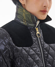 Load image into Gallery viewer, Model wearing Barbour Premium Carlton Quilt in Black/Classic.
