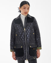 Load image into Gallery viewer, Model wearing Barbour Premium Carlton Quilt in Black/Classic.
