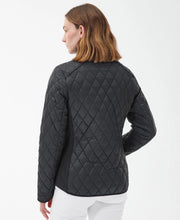 Load image into Gallery viewer, Model wearing Barbour Yarrow Quilt in Black/Rose Garden Floral - back.
