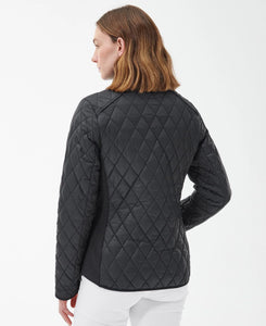 Model wearing Barbour Yarrow Quilt in Black/Rose Garden Floral - back.