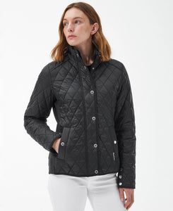 Model wearing Barbour Yarrow Quilt in Black/Rose Garden Floral.