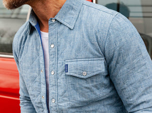 Model wearing Criquet - Quilted Shacket in Light Blue Chambray.