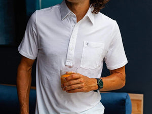 Model wearing  Criquet - Top-Shelf Players Polo in White.
