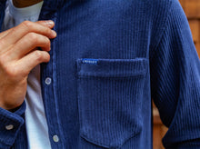 Load image into Gallery viewer, Model wearing Criquet - Velour Rib Knit Pearl Snap Button Down in Navy.
