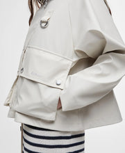 Load image into Gallery viewer, Model wearing Barbour June Showerproof Jacket in Blanc.
