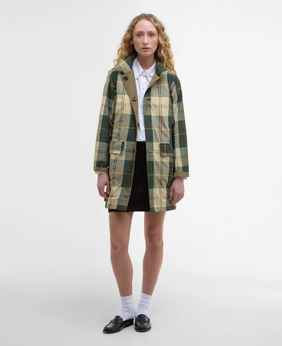 Model wearing Barbour Babbity Reversible Showerproof Jacket in Dusky Green/Ancient.