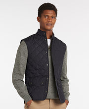 Load image into Gallery viewer, Model wearing Barbour Lowerdale Gilet in Navy.
