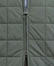 Load image into Gallery viewer, Model wearing Barbour Elmstone Quilted Gilet in Uniform Green.
