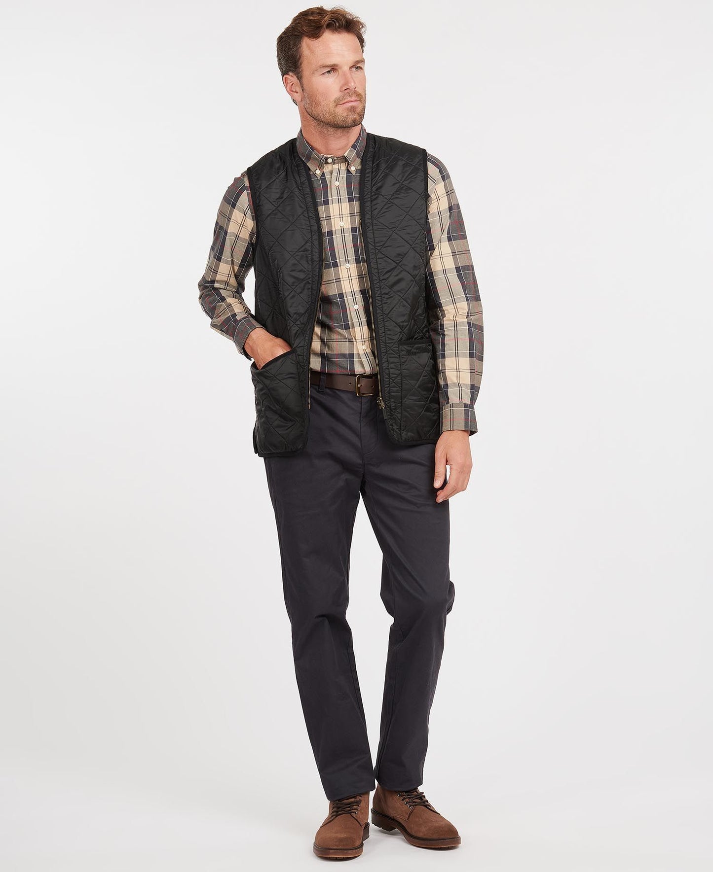 Model wearing Barbour Polarquilt Waistcoat Zip-In Liner in Black.