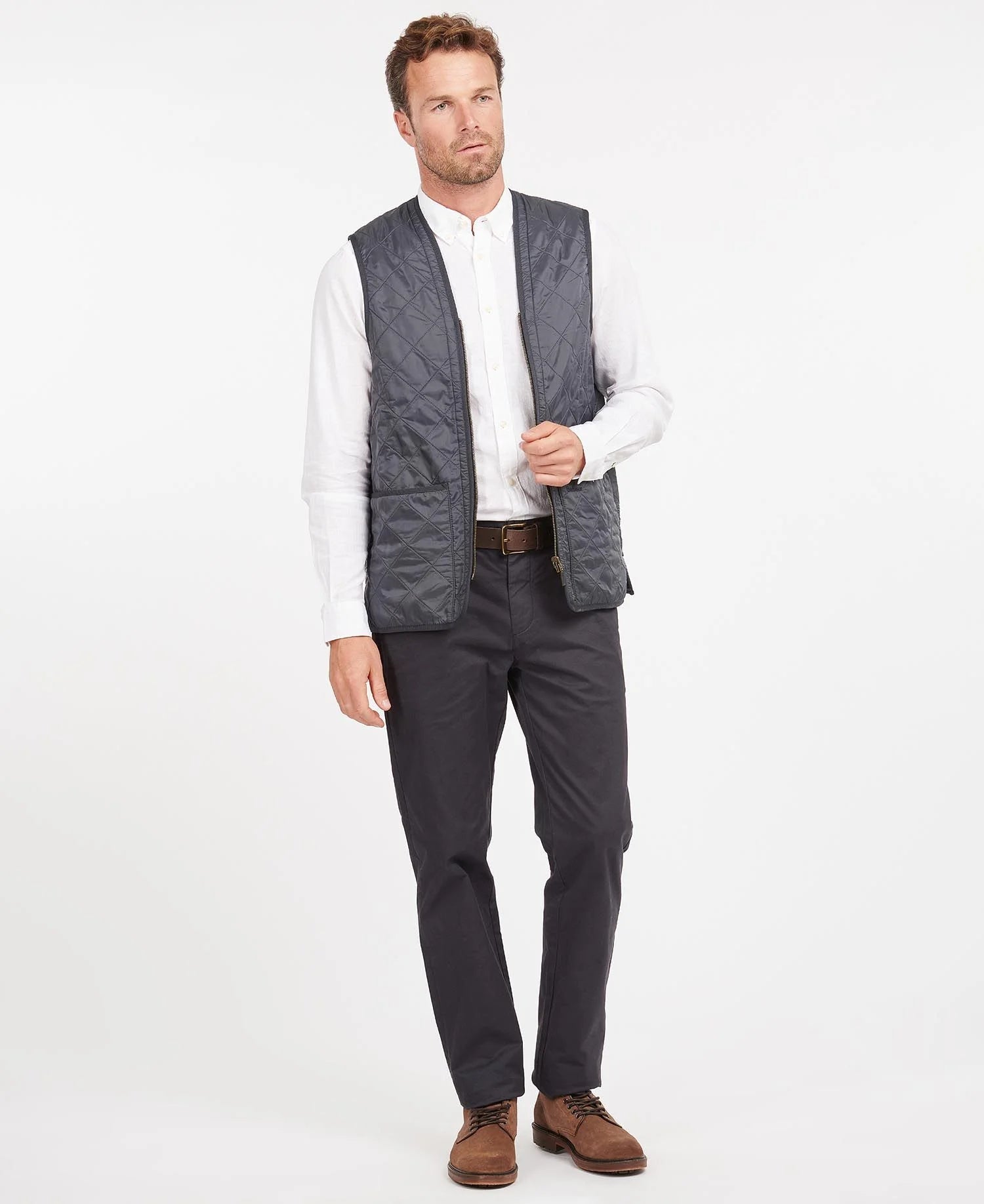 Model wearing Barbour Polarquilt Waistcoat Zip-In Liner in Navy.