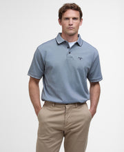 Load image into Gallery viewer, Model wearing Barbour Heydon Performance Polo Shirt in Navy.
